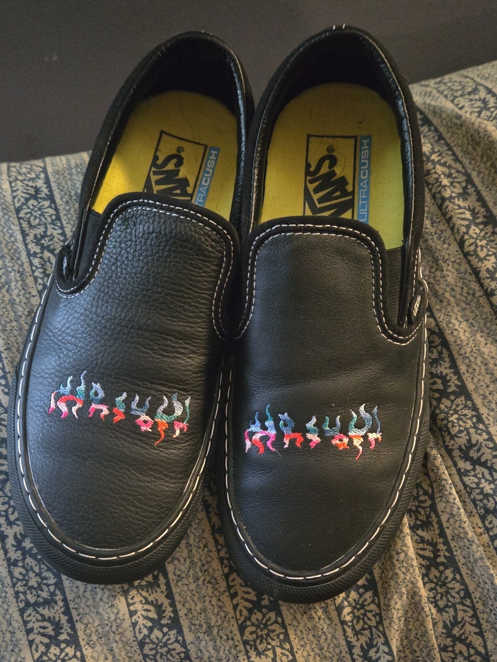 Vans Black Leather Slip-Ons with Multicolor Flame Stitching